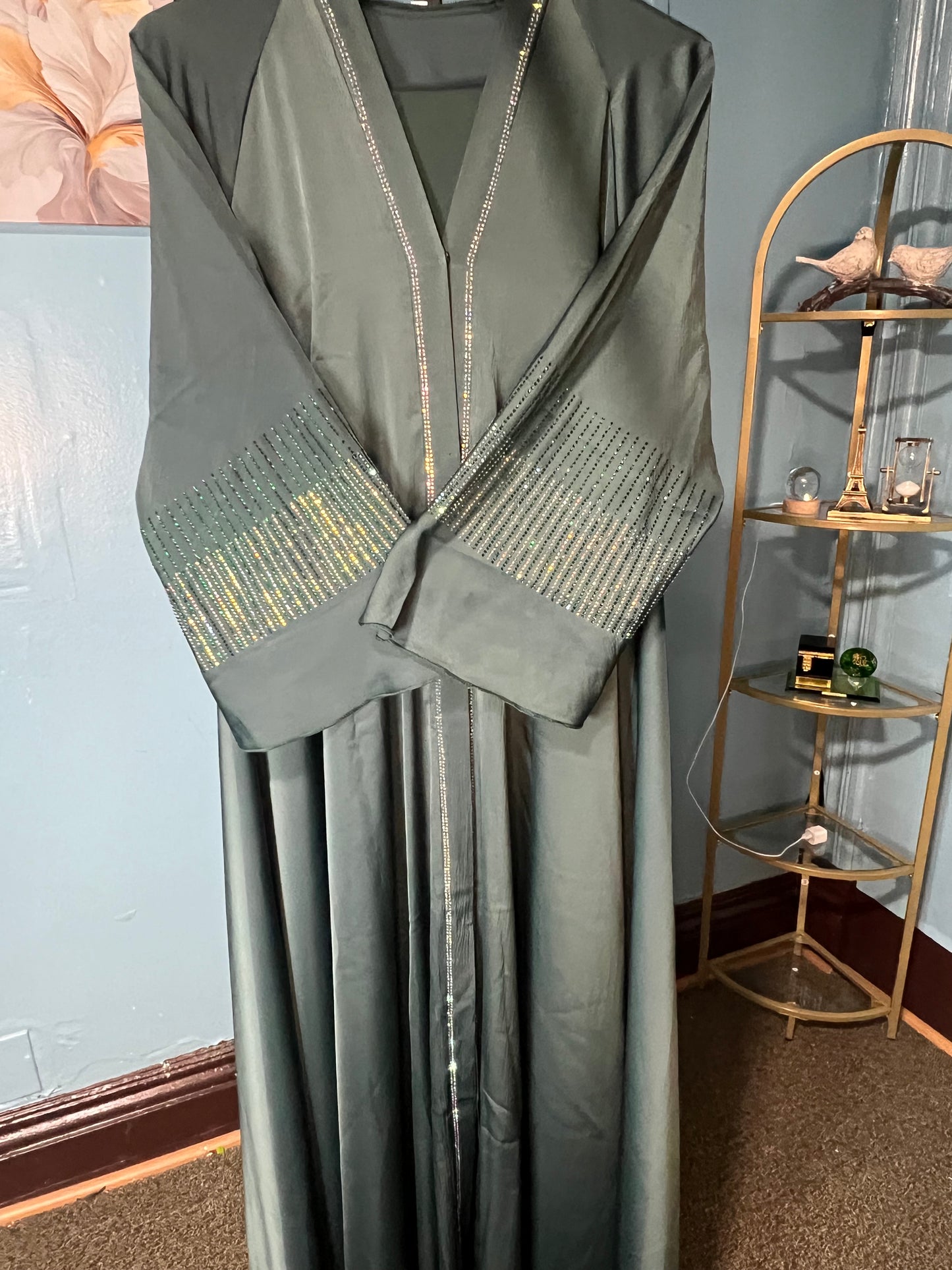 Teal-colored abaya with intricate rhinestone